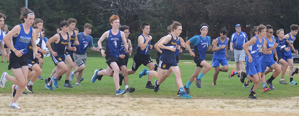 Runners from Wallkill and Highland begin a Mid Hudson Athletic League boys’ cross-country race at Wallkill High School on Sept. 14.